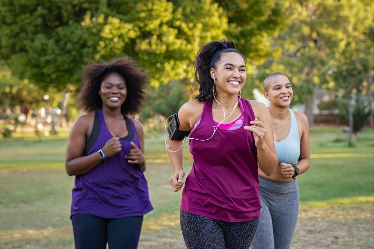 3 happy people jogging outside